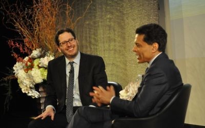 David Lubell (left), founder of Decatur-based Welcoming America, speaks with CNN's Fareed Zakaria during the Charles Bronfman Prize ceremony April 30 in New York.