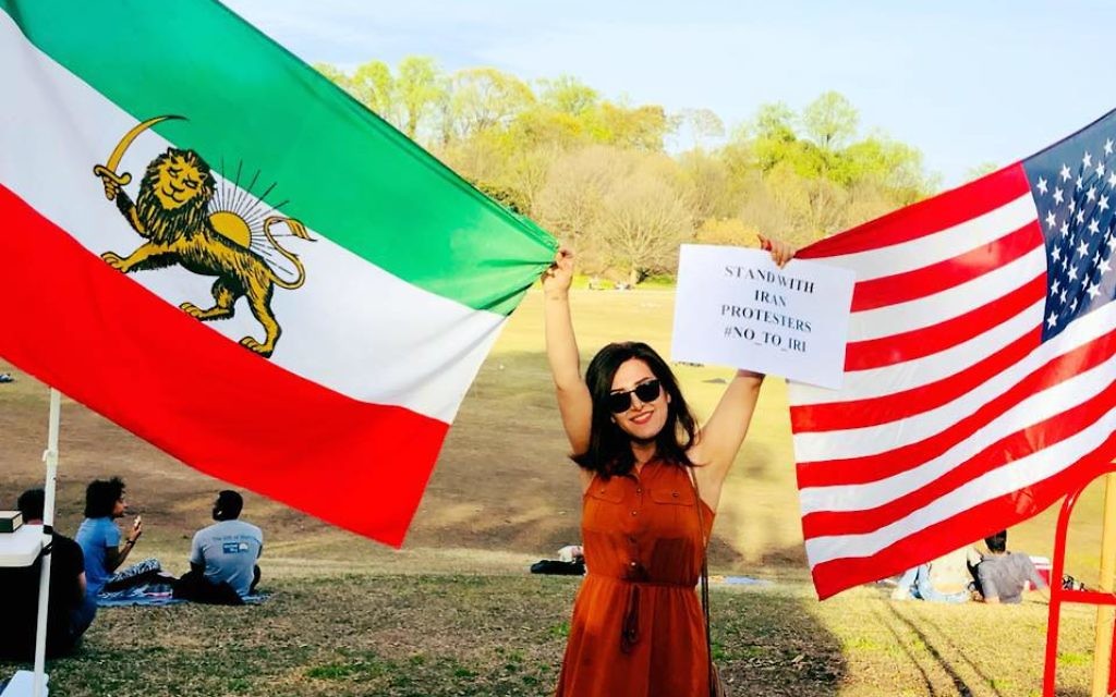 Iranian-American Hengameh Yazdani takes a moment to show her solidarity with America during the Atlanta Persian Festival Sunday, April 1 at Piedmont Park.