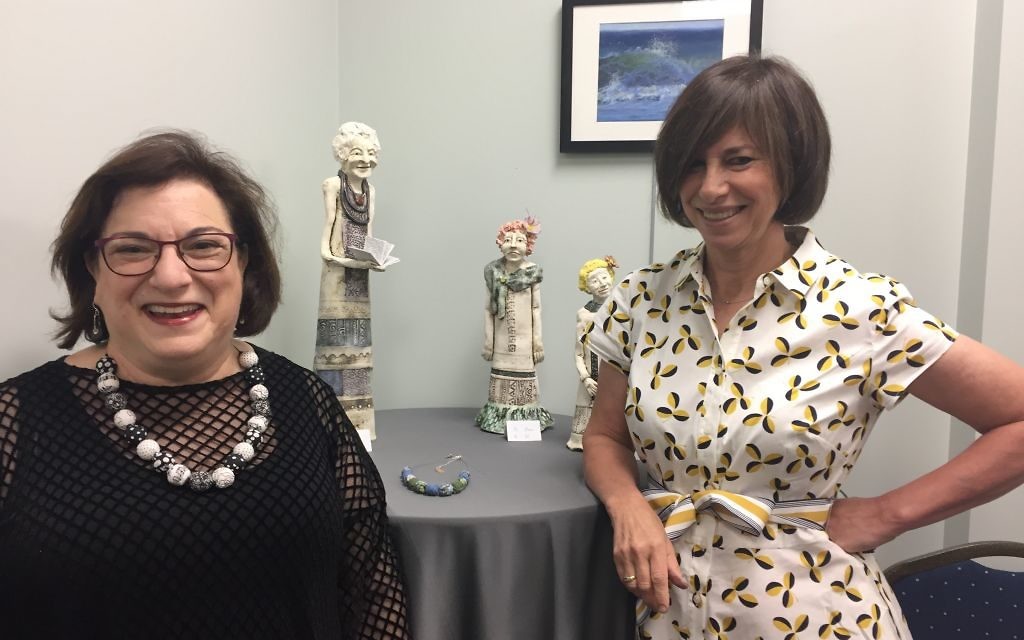 Sisters Judy Robkin (left) and Anita Stein display their contrasting art styles in a new exhibit at MACoM in Sandy Springs. (Photo by Marcia Caller Jaffe)
