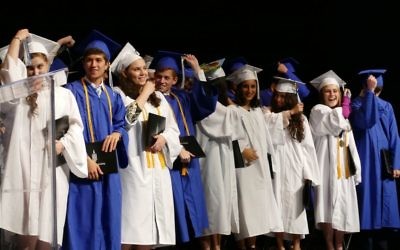 Members of the Class of 2018 flip their tassels to mark their transition from Atlanta Jewish Academy students to alumni.