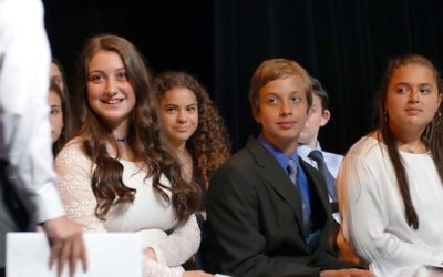(From left) Devorah Addess, Shayna Leibowitz, Josh Alhadeff and Mikayla Avdar-Rubin watch as Binny Frenkel returns to his seat after receiving his certificate.
