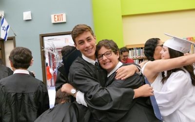 Alon Rogow and Nate Artzi share a post-graduation hug.