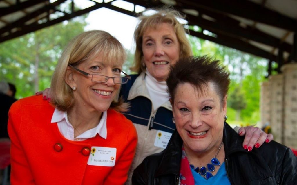 (From left) Liz Becker Lee, Mary Jane Becker and Reva Shapiro volunteer at the registration table.