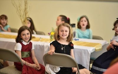 AJA first-graders, who planned the wedding lunch, also get to enjoy it.