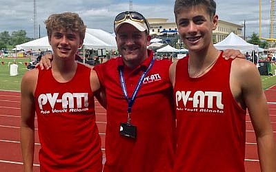 Coach Matt Barry (middle) stands with Nick West (left) and Alon Rogow (right), who qualified for the National Junior Olympic Track & Field Championship.
