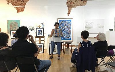 Photo courtesy of Donna Kreuger/dk Gallery //
Flora Rosefsky speaks about her work, “S’chach,” at dk Gallery in Marietta.