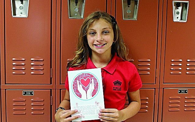 Ruby Mundell showcases her book, "Kindness Come In," to help children and adults face and overcome challenging times.