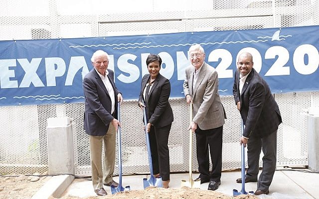 Breaking ground on the aquarium expansion are, from left, Mike Leven, Mayor Keisha Lance Bottoms, Bernie Marcus and Joe Handy.