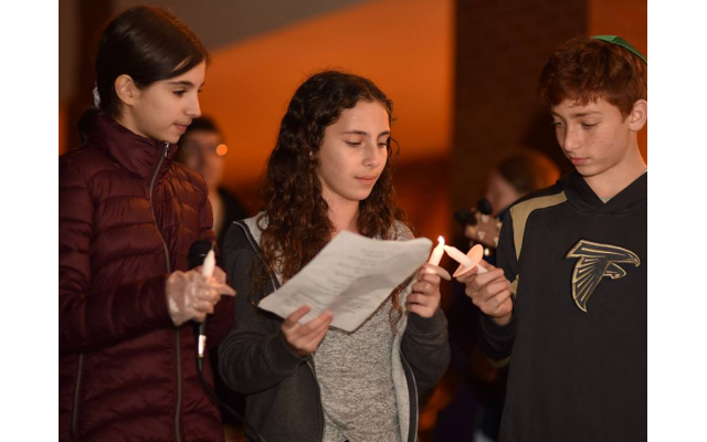 Photos by Beth Intro Photography // Eighth graders Eva Beresin, Ayla Cohen and Josh Shulman starting the candle lighting.