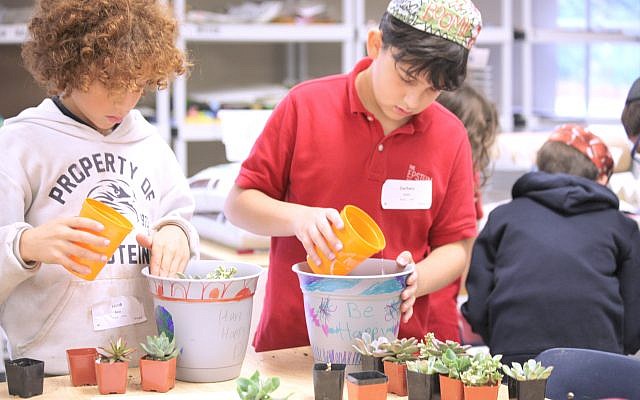 Fourth-grade students Jacob Ross and Zachary Covin decorated and planted pots to show their gratitude for their teachers.