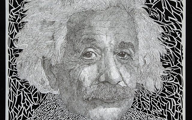 Dan’s detailed stencil  4-by-4-foot “Albert Einstein”  lets the light shine through.
