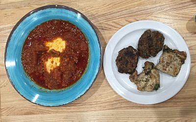 Traditional tomato-based shakshuka alongside tastes of lamb kebab and pargiot.