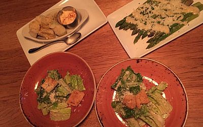 Deliciousness before the entrée (clockwise from top left): Rice flour flash-fried artichokes, asparagus Parmesan, authentic Caesar salad (split in two portions).