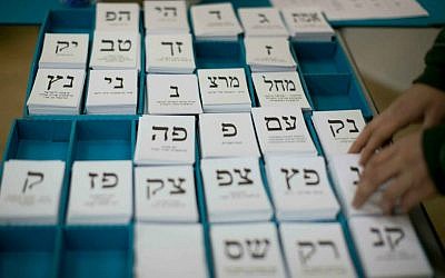 Photo via Times of Israel // Knesset election ballots at a polling station in Jerusalem, January 22, 2013.