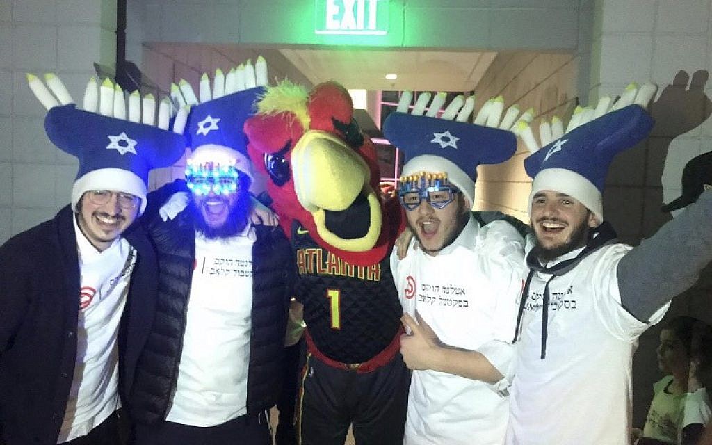 Harry the Hawk poses with students at the 6th annual Jewish Heritage Night.