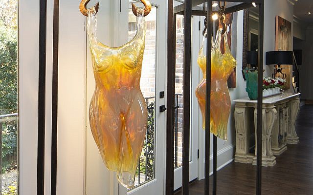 Mark’s favorite piece is a Murano glass woman by Alexis Silk, known for her freehand sculpture of human anatomies. Mark liked the lighting, shape and amber hue.