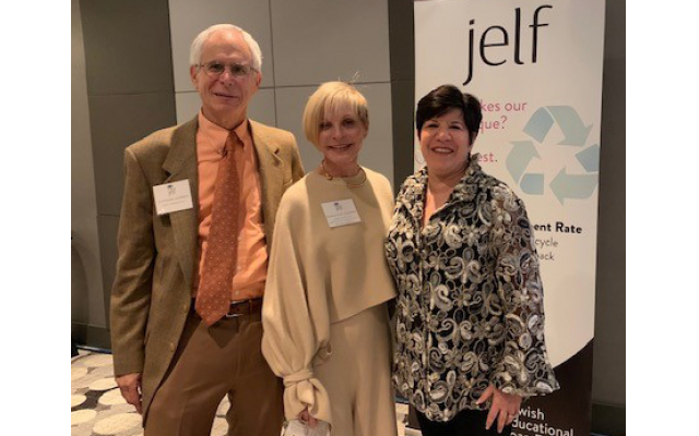 Former JELF presidents Drs. Steve and Marianne Garber congratulate Eydie Koonin, award recipient and executive board member.