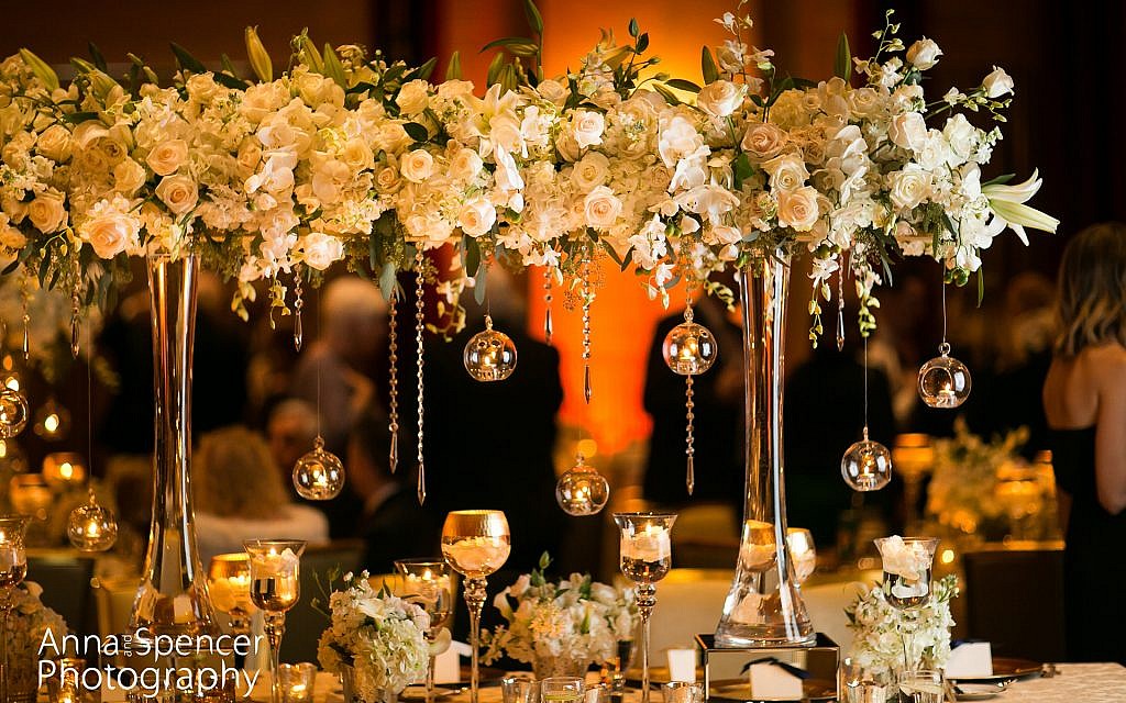 Photo by Anna and Spencer Photography // Dramatic centerpiece florals featuring hanging candles.