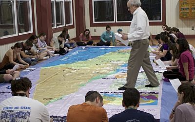 Photos courtesy of CIE // Center for Israel Education President Ken Stein uses a floor map of Israel to educate Jewish camp staffers about its geography during CIE's inaugural three-day seminar at Camp Ramah Darom in Clayton, Georgia.