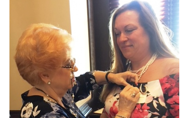 Linda Hakerem presented the president’s pin to Michele Weiner-Merbaum.