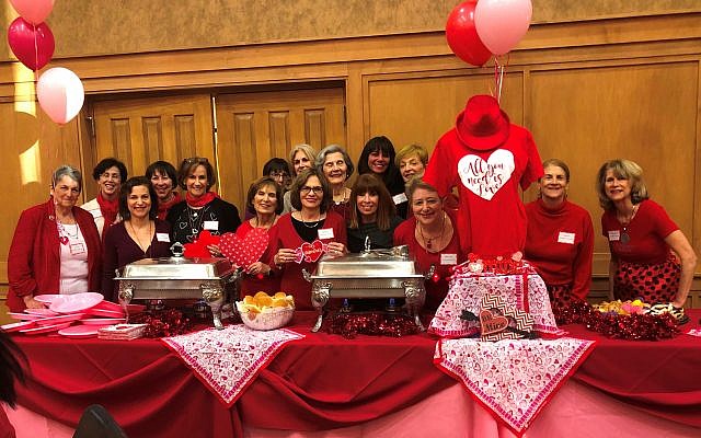 The auxiliary volunteers spread love and upbeat wishes for Valentine’s Day. Sherry Jaffe Habif, left of the heart T-shirt, decorated the room.
