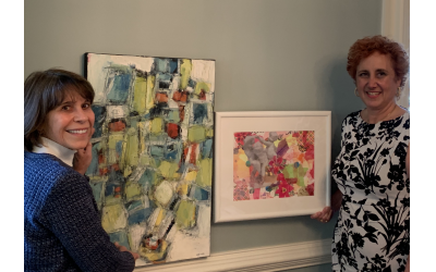 Outgoing ACS president Ellen Stein (left) shows off her collage alongside incoming president Terri Hitzig and her work.