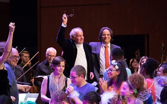 Reiman takes a bow at the Atlanta Symphony Orchestra with composer Robert Elhai after a performance of “Jump: A Cultural Symphony.”