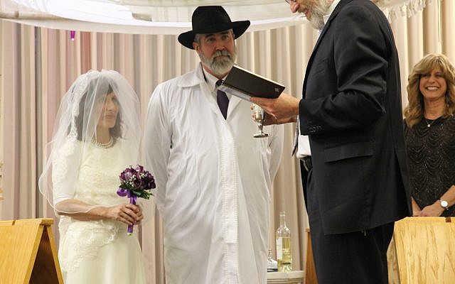 Kathleen and Paul Gray’s wedding at the Sandy Springs Kehilla Jan. 2 with Rabbi Karmi David Ingber.