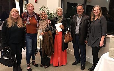The interfaith community came together to hear author-activist Mohammed Al Samawi at Temple Beth Tikvah. Pictured here are members of the Emerson Unitarian Universalist Congregation, East Cobb Islamic Center and Rabbi Alexandria Shuval-Weiner (right).