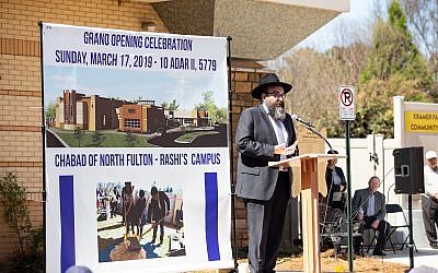 Rabbi Hirshy Minkowicz addresses the community at the opening of North Fulton Chabad Rashi’s Campus.