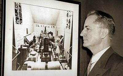 Oglethorpe University President Thornwell Jacobs, the “father of the modern time capsule,” looking at a picture of the Crypt of Civilization’s contents before its door was welded shut.