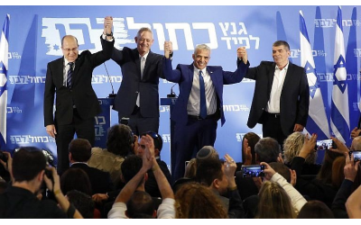 From left: Blue and White party leaders Moshe Ya’alon, Benny Gantz, Yair Lapid and Gabi Ashkenazi pose for a picture after announcing their electoral alliance in Tel Aviv on February 21, 2019. (Jack Guez/AFP)