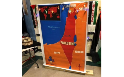 A map of the Middle East replacing Israel with Palestine is shown in a photo of the Multicultural Night at Autrey Mill Middle School posted on Jewish Moms of Atlanta Facebook group page.