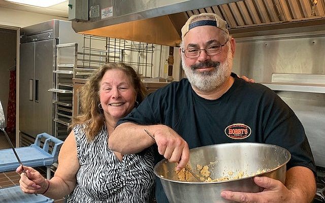 Lori and Marty Gilbert whip up a batch of matzah brie.