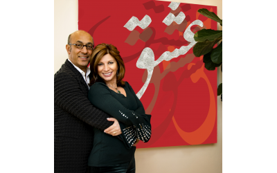 Photos by Duane Stork // The couple poses by Kamy’s original creation ESHGH, “love,” in Farsi. It is mixed media with resin and diamond dust.