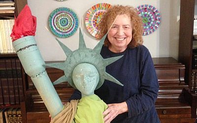 Chana Shapiro is known for her collections, including the Statue of Liberty, and her art projects, such as the decorative plates in the background.