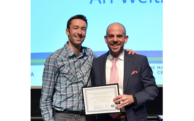MJCCA CEO Jared Powers presents awards at the annual meeting to Nora Floersheim, Glenn Frank, Ari Weitz and Zak Elfenbein (on behalf of his program), among many others.