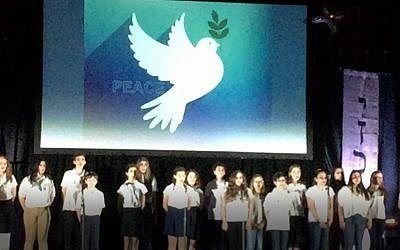 Students from The Weber School sing the song “Peace” during the annual community Yom Hazikaron commemoration.