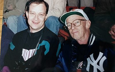 Dave Schechter and his father, Dan (right, displaying his allegiance by wearing his New York Yankees jacket over a borrowed Braves sweatshirt) at a 1996 World Series game in Atlanta.