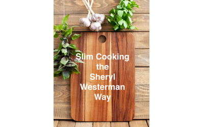 Cutting board with space for text, fresh basil and garlic on wooden background, vertical