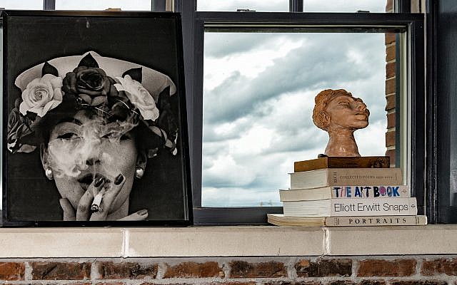 William Klein’s “Hat + Five Roses” is one of Good's favorites. The sculpture on right was created by her grandmother.