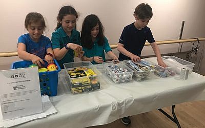 Children participate in a community service project with The Packaged Good.