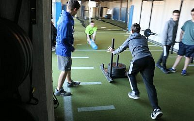 Students in the strength and conditioning class, the first step in the Sports Science Academy’s honors diploma program.