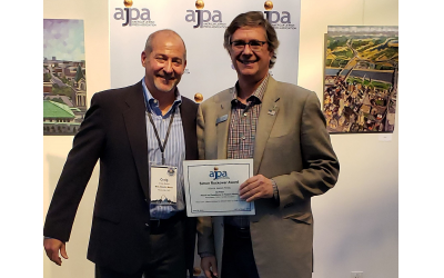 AJT Publisher Michael Morris, right, receives one of the paper’s four AJPA Simon Rockower Awards from Craig Burke of Mid-Atlantic Media.