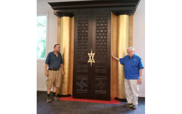 Jonathan Alexander helped Israel Peljovich restore the ark doors.