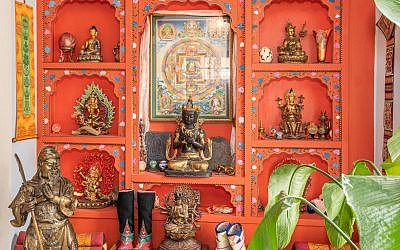 Scott constructed this entire wall for his Tibetan art collection. His mother was co-owner of a trekking agency to exotic locations.