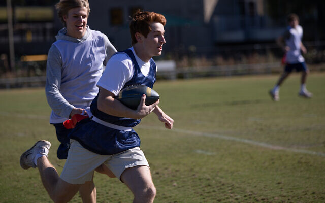 Photo by Eddie Samuels // Playing seven-on-seven, some of the older participants played the whole length of the field.