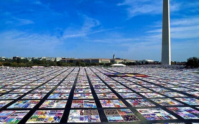 The quilt has some 50,000 panels sewn into 12-by-12-foot blocks bearing the names of more than 105,000 people that when spread out would span more than 1.3 million square feet.