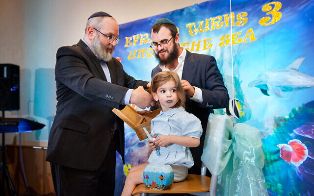 Photo by Sarah Slavik Photography // Three generations:  Grandfather Leo and dad Eli cut a lock of hair.