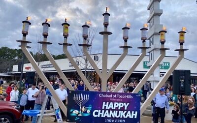 Members of Chabad of Cobb, Congregation Beth Jacob and Congregation Ohr HaTorah were among those who gathered to publicly celebrate the last night of Chanukah.